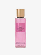 Pink bottle of Victoria's Secret Pure Seduction Shimmer fragrance mist on a white background
