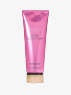 Pink Victoria's Secret Pure Seduction lotion bottle on a white background