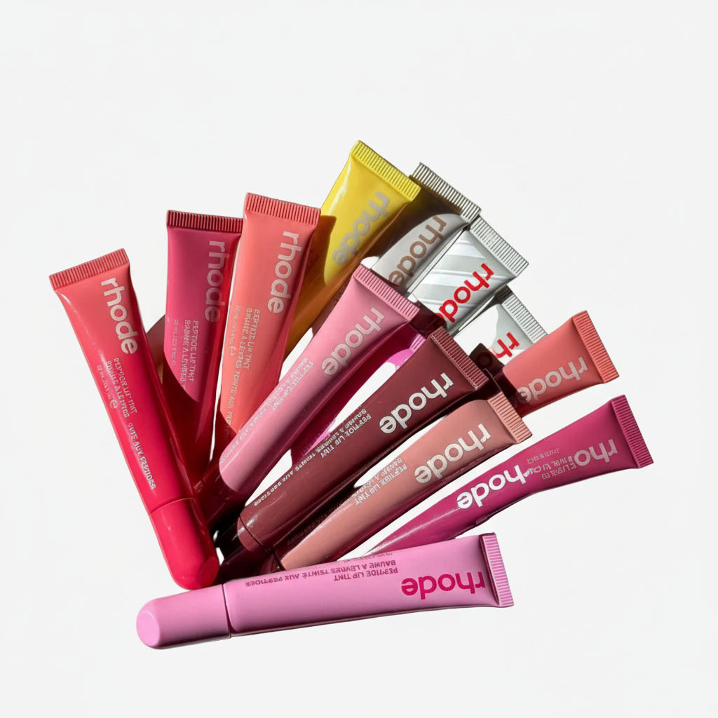 Collection of Rhode lip products on a white surface